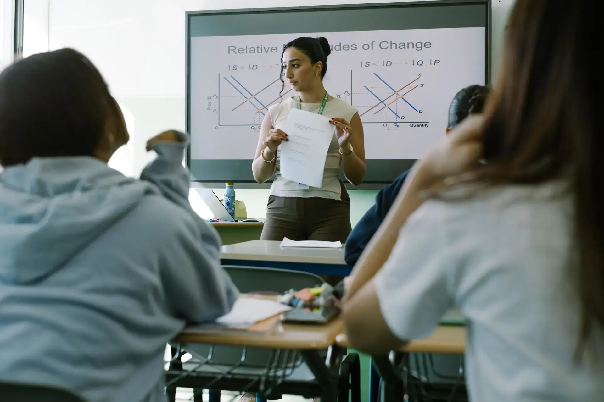 teacher speaking to students during a classroom lesson