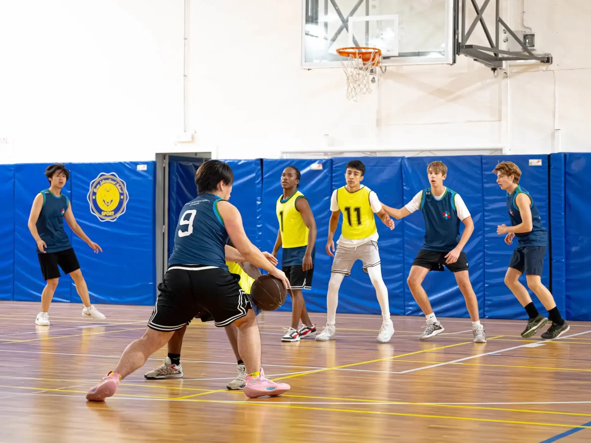 middle school students playing basketball 