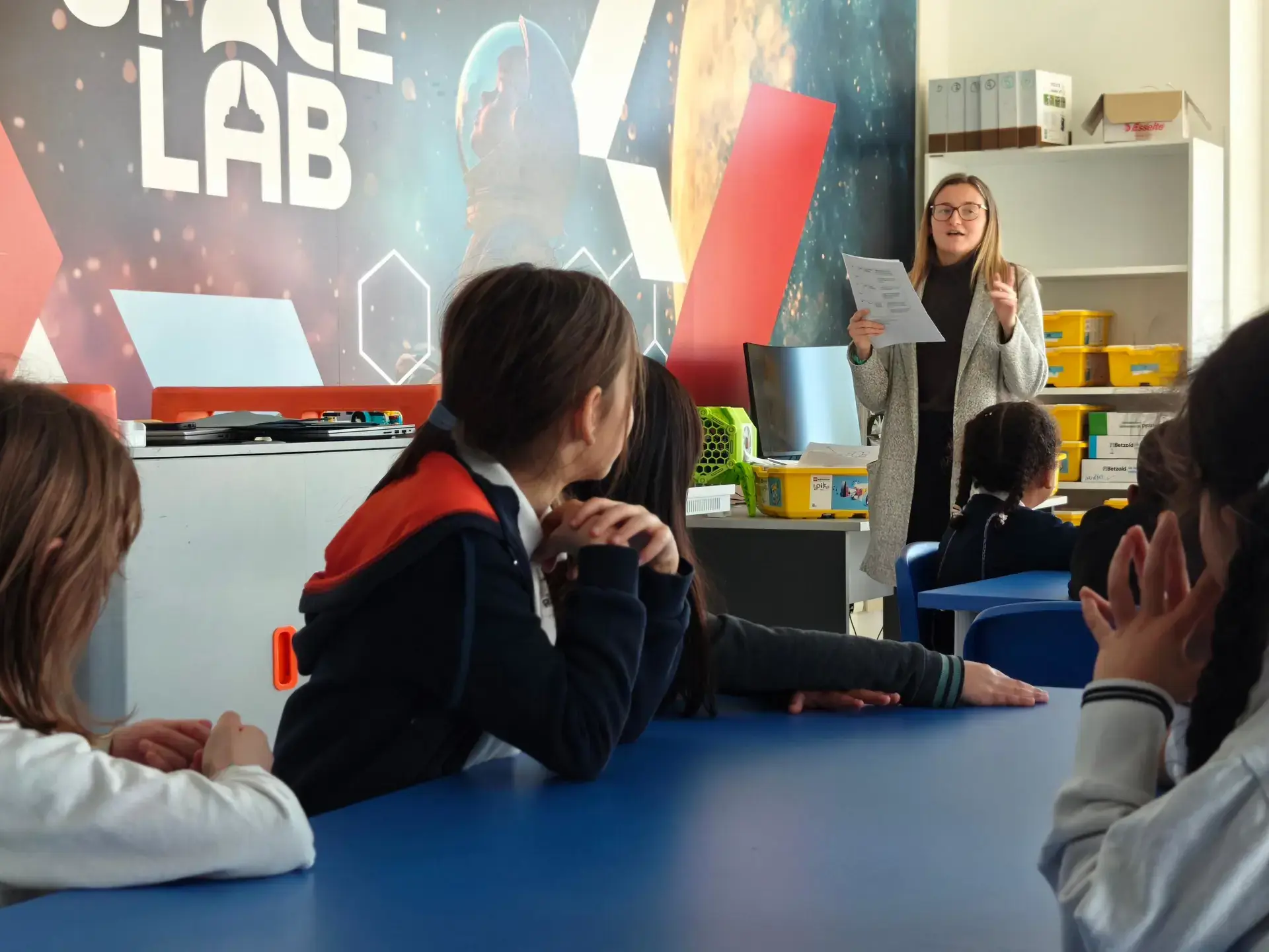 teacher speaking to students in the space lab classroom