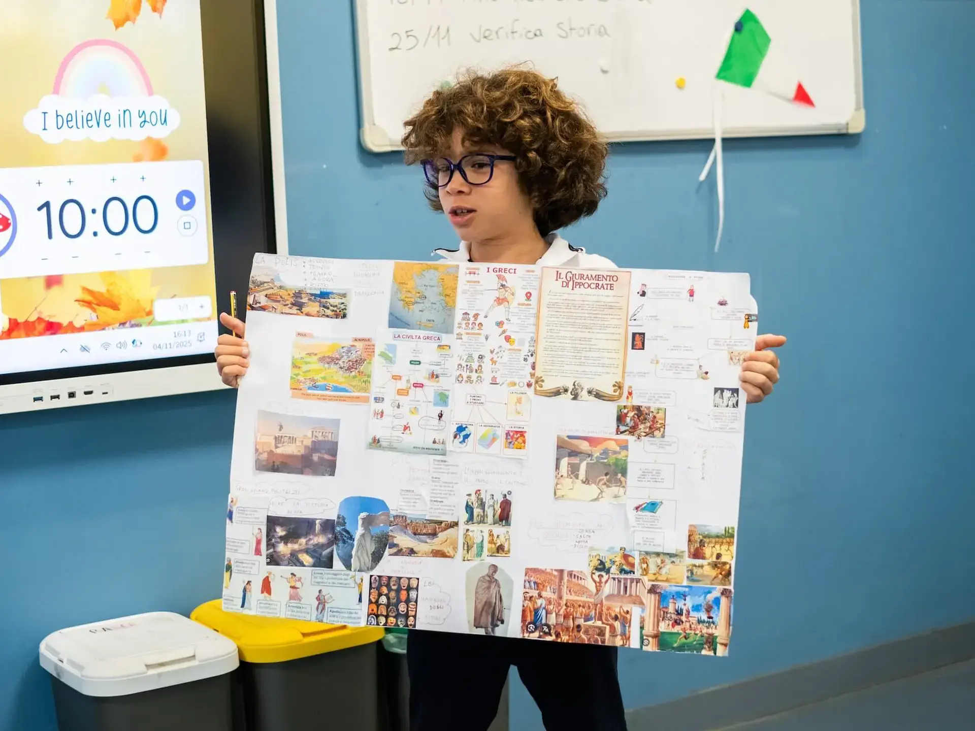 student presenting a poster on ancient greek civilization in class