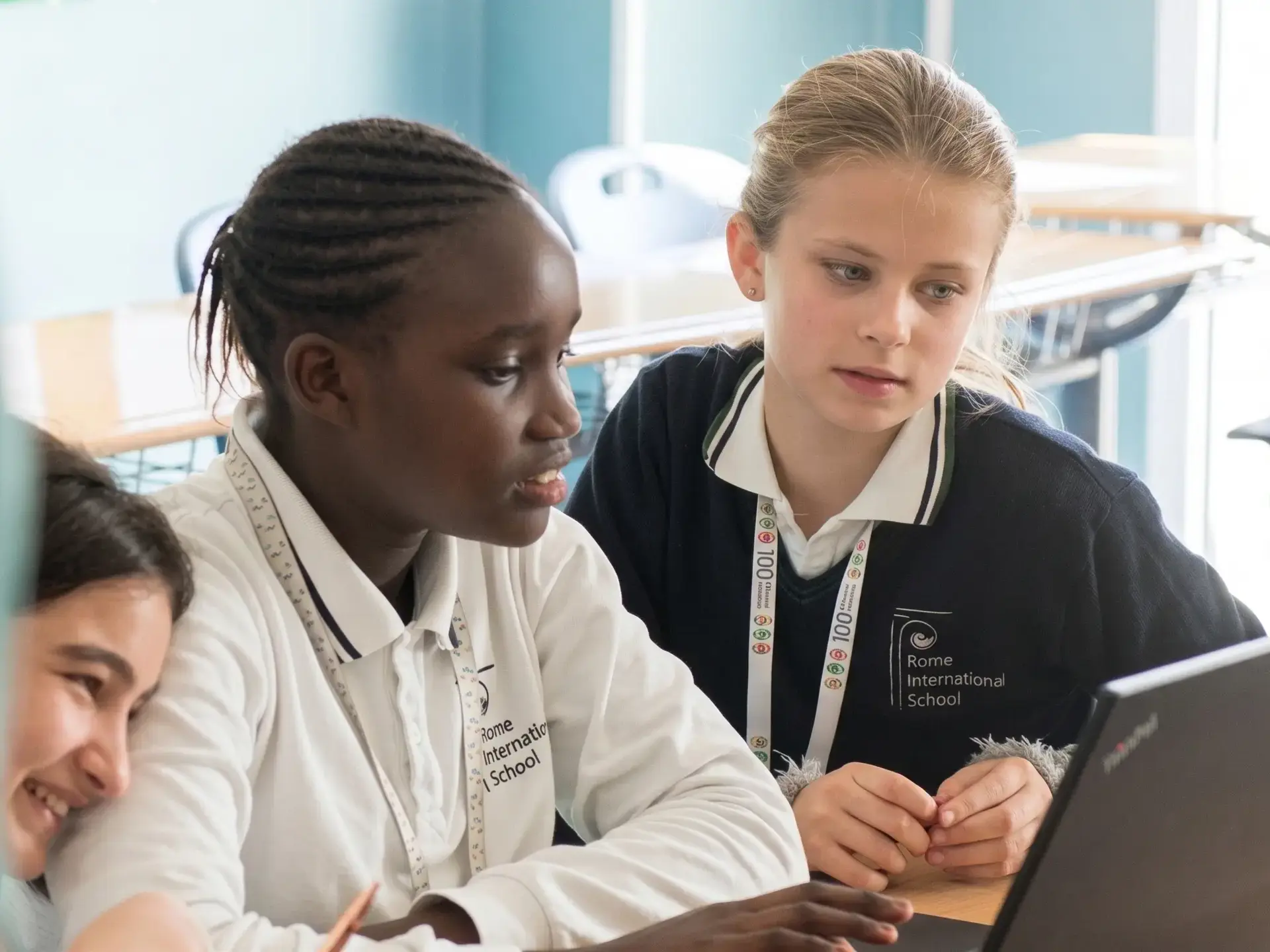Middle School Students working on laptops.